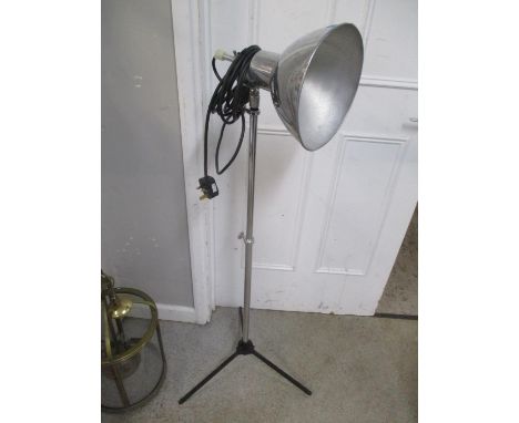 A retro industrial chrome and black painted tripod lamp 