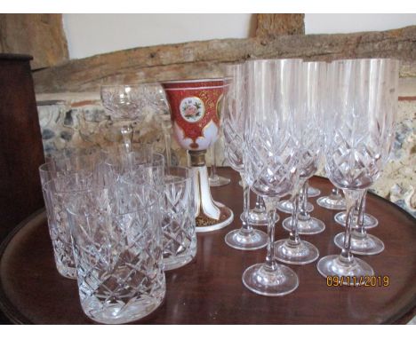 An Austrian ruby and gilt chalice, together with a part suite of drinking vessels 