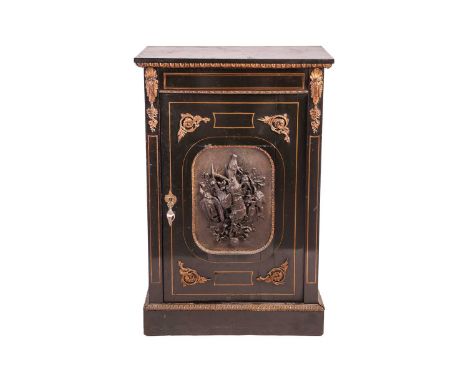 A Napoleon III ebonised single-door pier cabinet. with brass inlay, the door with a central electrotyped panel of hunting tro