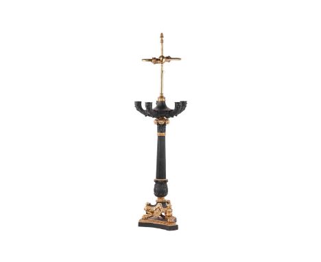 A Louis-Philippe style gilt metal and ebonised colza style table lamp 20th century, with rise and fall action, over an eboniz