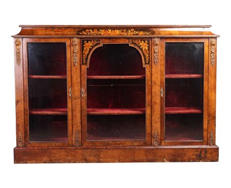 A Victorian marquetry inlaid figured walnut caddy topped credenza, with panels of inlaid cut blooms to the concave caddy top,