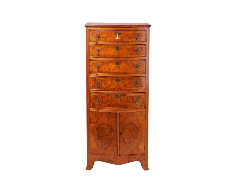 An 18th-century style figured walnut bow-fronted pedestal chest, early 209th century, with cross banded quartered top  with f