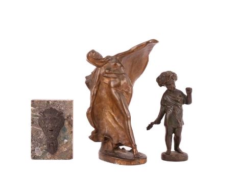An unattributed Art Deco patinated and gilt bronze figure of a lady dancing in Bedouin dress, early 20th century, on an oval 