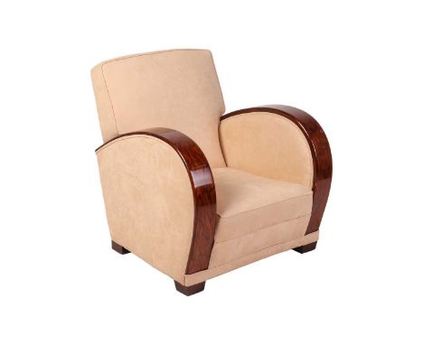 In the manner of Epstein &amp; Goldman, a walnut Art Deco 'Roll Over' armed tub chair, with ivory stuff over upholstery, and 