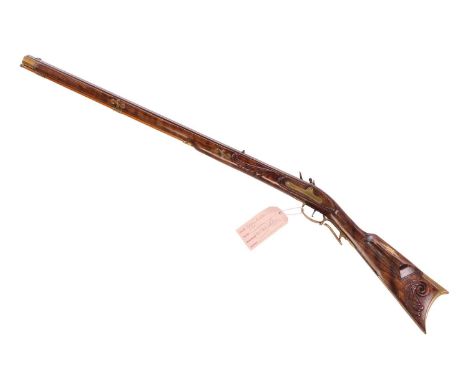 In the manner of Peter White; a 50 calibre Kentucky flintlock rifle (reproduction), the stock with high comb and inlaid waddi