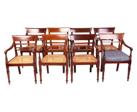 A set of Anglo-Indian teakwood open-arm chairs, probably first half of the 20th century, with broad cresting rails over split