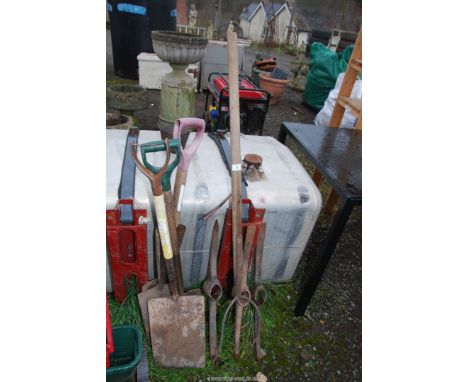 Spades, hayfork and pick axe heads.