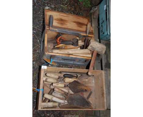 Two boxes of wooden handled tools, trowels, chisels, mallet, etc.