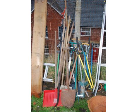 A quantity of garden tools, spades, shovels, rakes, etc.