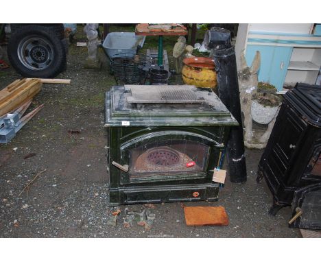 An 'Efel' green enamel oil burning stove [a/f ]  with a piece of flu pipe etc.