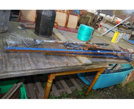 A quantity of sash clamps and a rake.