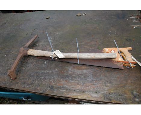 A pick axe and 2  handsaws.