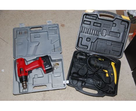 A hammer drill and a battery powered drill (no chargers).