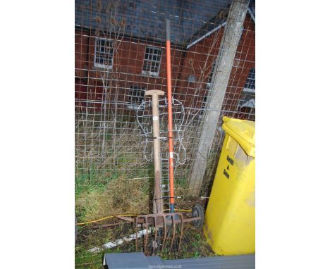 A rake, pick axe, fork, etc.