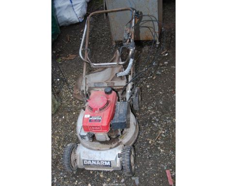  A Danarm  lawn mower with Honda engine. [engine turned at time of lotting].