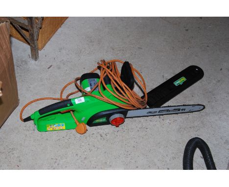 A "Flora Best" electric chainsaw with spare blade.   