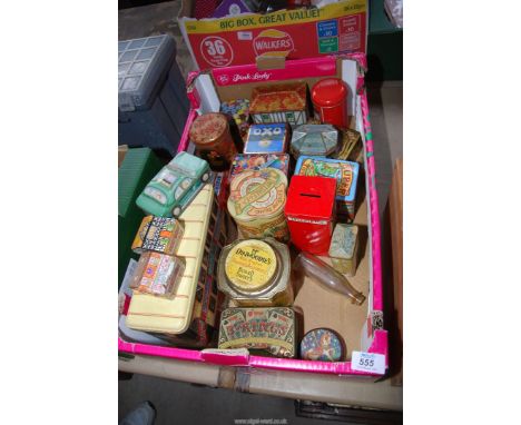 A quantity of vintage tins to include: Oxo, Smarties, and some money boxes.