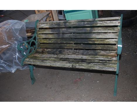 A garden bench with cast iron ends. 49" wide x 15" depth x 29" high.