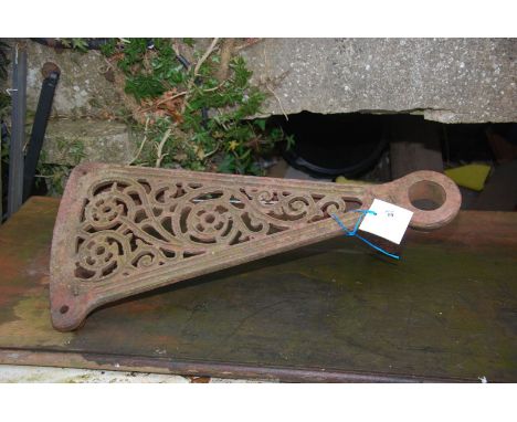 A cast iron step from a spiral staircase.