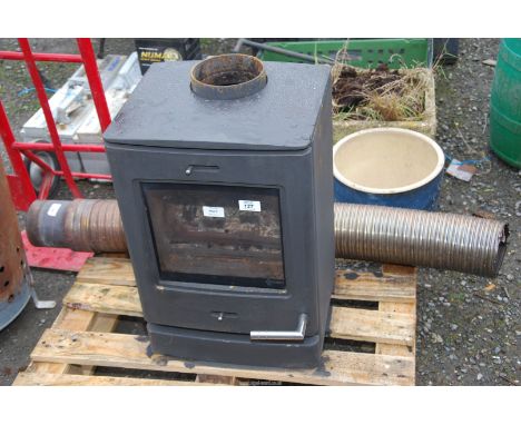 A 'Yeoman' Woodburner and part flue pipe, 21" high x 24" wide and 12" deep.