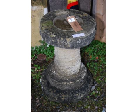 A sundial on concrete plinth, 21" tall.