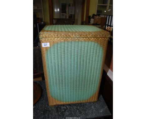 A Lloyd loom style linen basket.