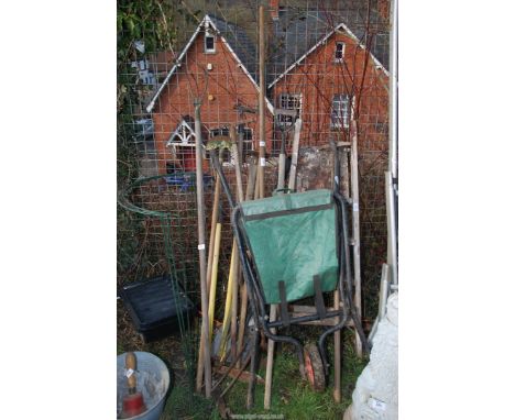 A quantity of tools, a step ladder, a fold up wheel barrow, rakes, hoes, shears, forks, etc.