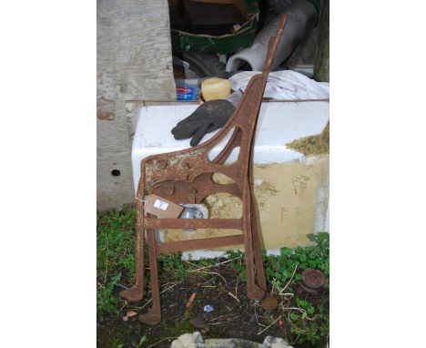 A pair of cast iron bench ends.