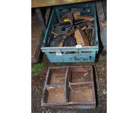 A box of tools, sharpening stones, wooden trug, etc.