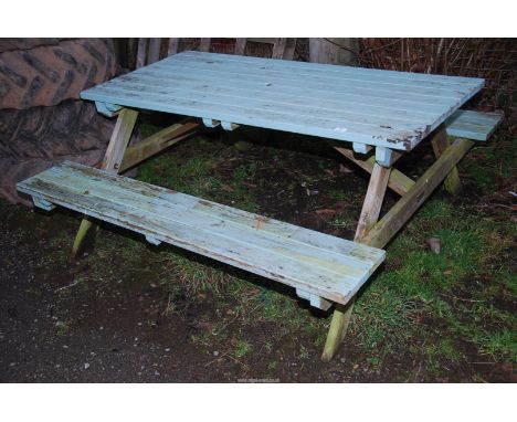 A picnic bench, 59" long x 59" wide x 24'' high.