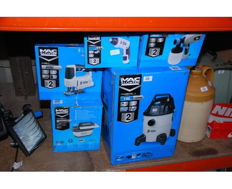 A "MacAllister" wet and dry vacuum, a paint sprayer, a jigsaw ( not working at time of lotting), a wall paper stripper and a 