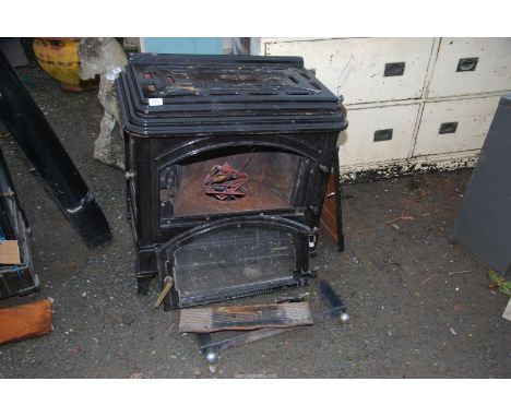 A 'Euro heat black enamel oil burning stove [a/f] with parts etc.