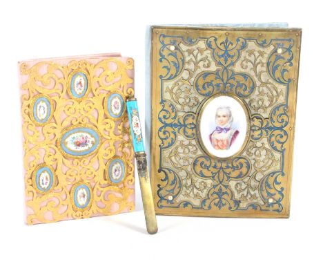 A gilt metal and porcelain mounted book form blotter, 19th century, set with oval Sevres style plaques decorated with flowers