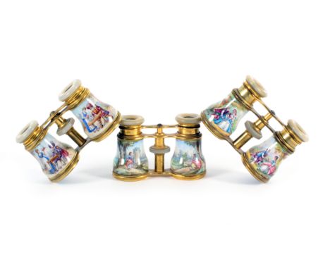 Three pairs of 19th Century enamel decorated opera glasses, all with mother of pearl eye rims and variously decorated enamel 