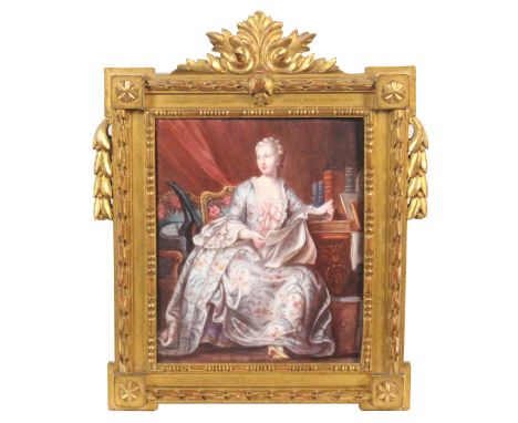 A French enamel plaque - early 20th century, depicting Madame Pompadour, seated, reading a paper beside a table, with books, 