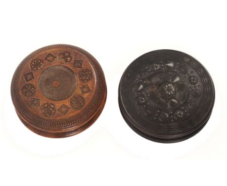 Two 19th Century engine or rose turned circular snuff boxes, comprising a figured oak example with geometric decoration, inte