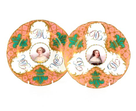 A pair of Sevres style plates each with central circular portrait, floral initials within pink and gilt borders with green fl