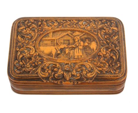A good 19th Century Tyrolean carved boxwood rectangular snuff box, the lid carved with a girl feeding cattle before houses se