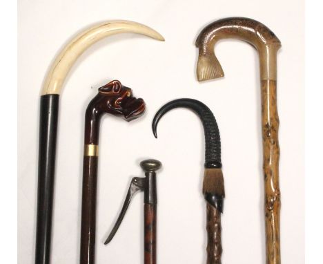 Five walking sticks comprising a Victorian gadget stick for picking fruit, 95cm, a Tyrolean walking stick with horn and hoof 