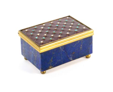 A blue lapis rectangular gilt mounted box, the lid with an inset red enamel plaque with a trellis design of seed pearls and t