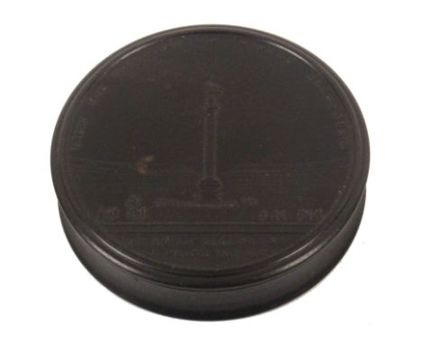 A 19th Century French Bois Durci circular snuff box, the lid titled ‘Fruit Des Victoires De L’Armee Francais/Vic De La Colonn