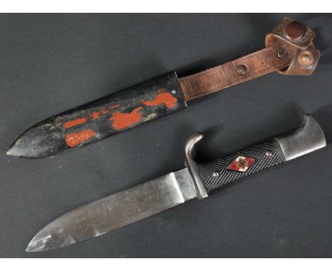 A WWII Second World War Third Reich Nazi German Hitler Youth knife / dagger. The dagger having a hooked pommel, black chequer
