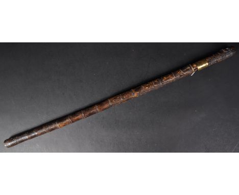 A 19th Century Victorian gentleman's sword stick / walking cane with concealed blade. The cane having a rootwood like pommel 