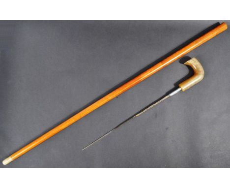 An early 20th Century c1910 gentleman's sword stick / walking cane with concealed blade. The cane having a curved Rhino horn 