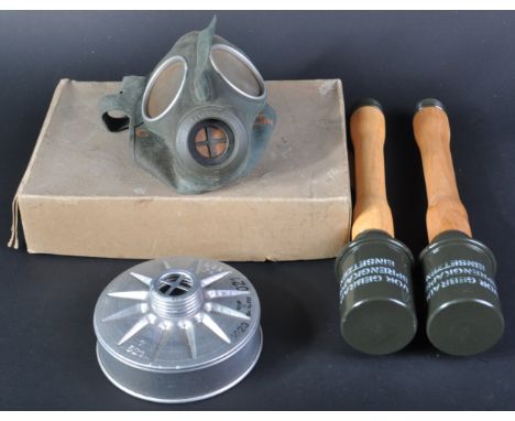 An original WWII Second World War Third Reich Nazi German respirator / gas mask and two re-enactment M24 stick grenades. The 