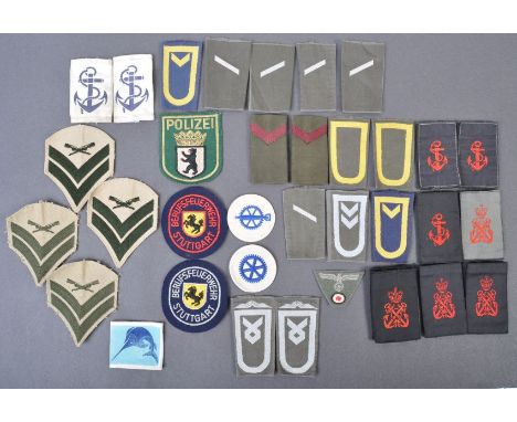 A large collection of assorted WWII Second World War and other British Navy uniform cloth patches and rank slides comprising 