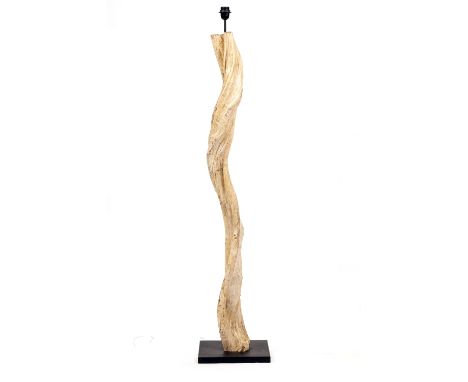 A FLOOR STANDING LAMP constructed from a sculptural wooden branch, on a square black painted base, the base 30cm wide, the la