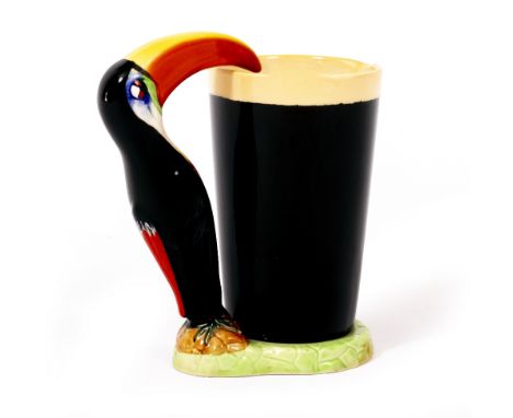 A CARLTONWARE LIMITED POTTERY GUINNESS ADVERTISING JUG  with a toucan handle, numbered GA/2316 to the base, 16.5cm wide x 18c
