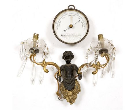 A BRASS CASED ANEROID BAROMETER AND THERMOMETER with ring suspension, 12.2cm diameter together with a two branch wall light (
