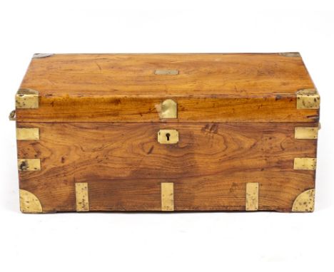 A 19TH CENTURY TEAK AND CAMPHOR WOOD LINED TRUNK with brass mounts and later brass handles, 92cm wide x 50cm deep x 38cm high